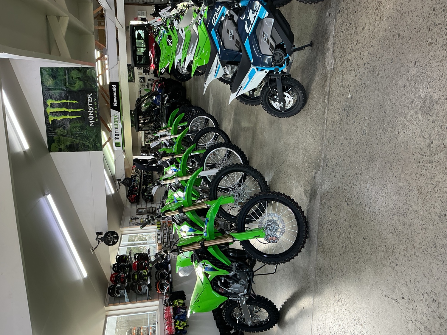 Kawasaki motorcycles lined up inside the Motoworx showroom