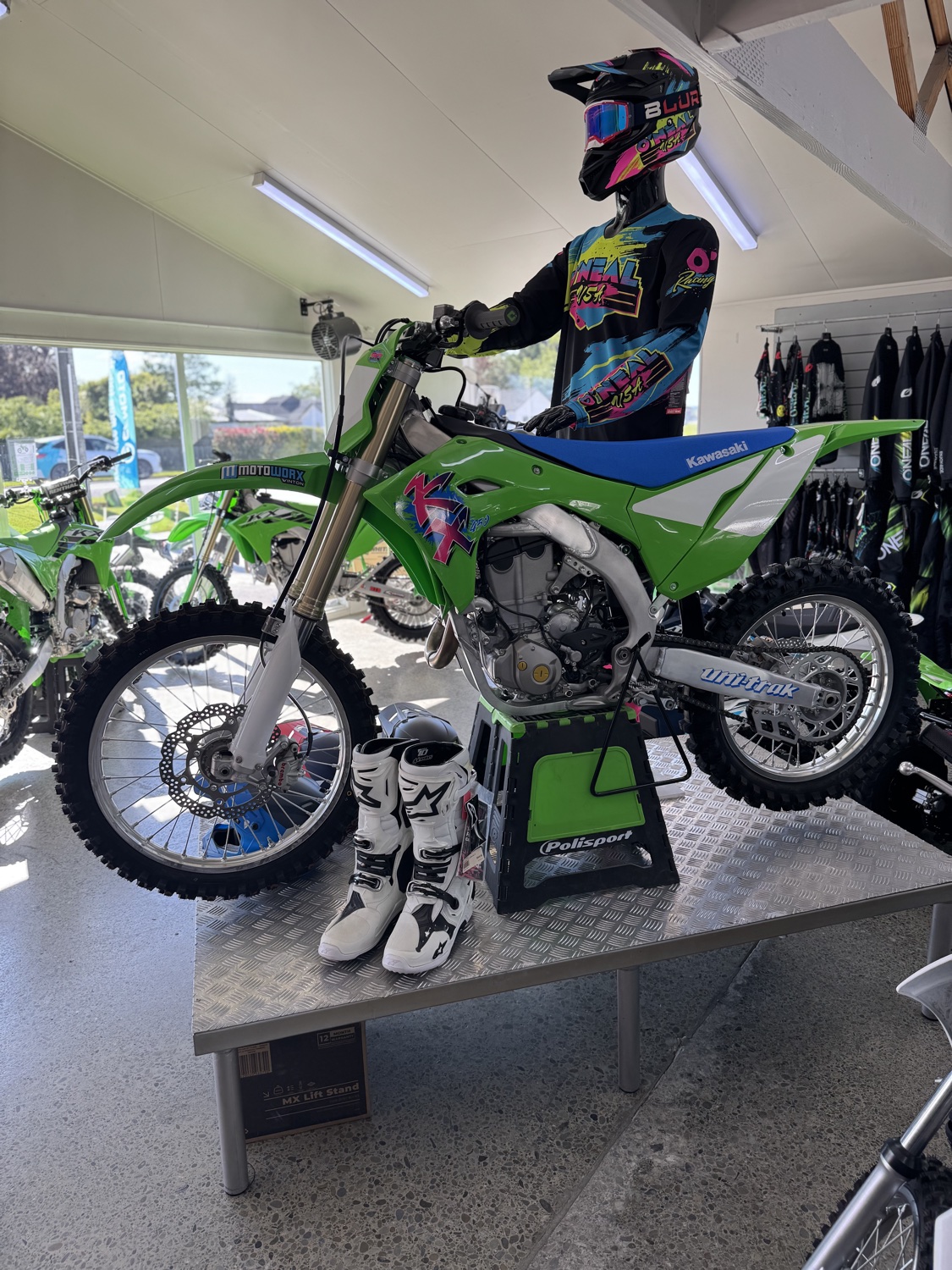 A green motorcycle on display at Motoworx