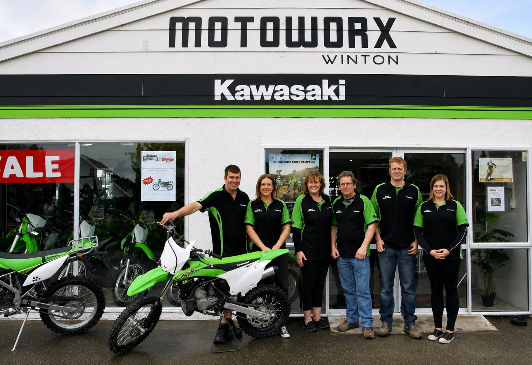 The Motoworx Winton team with Kawasaki motorcycles outside the showroom